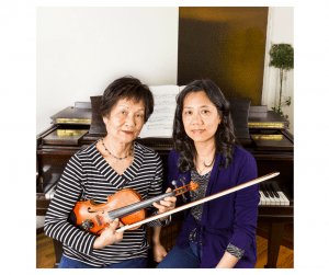 violin teacher with student