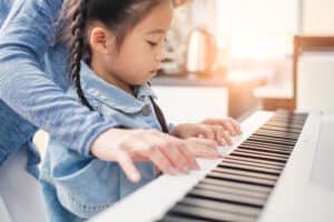 Girl Learning Group Piano in Lexington MA